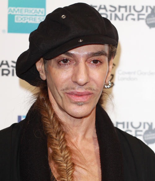 John Galliano, 61, smokes a cigarette as he lunches with his stylist  boyfriend